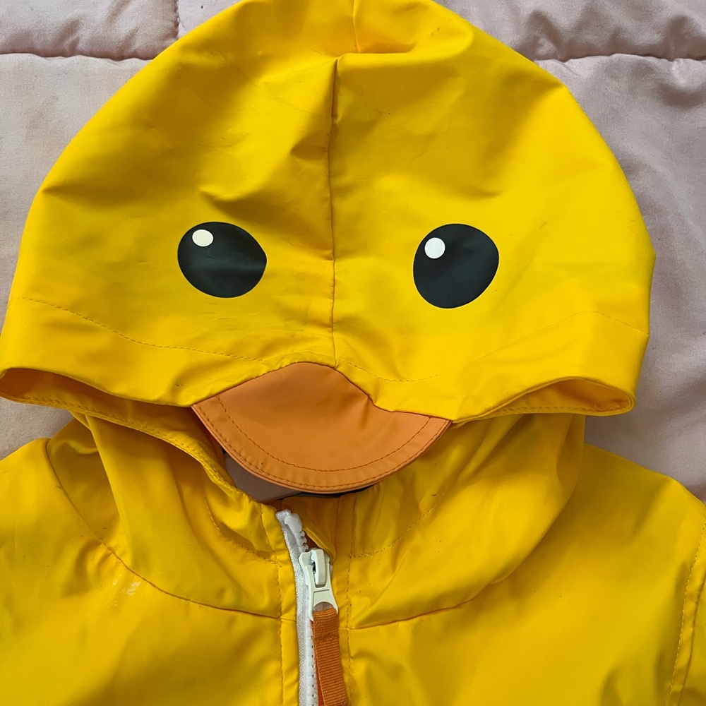 Yellow Raincoat with really cute 🐤🐥 hoodie. Stripes on the inside